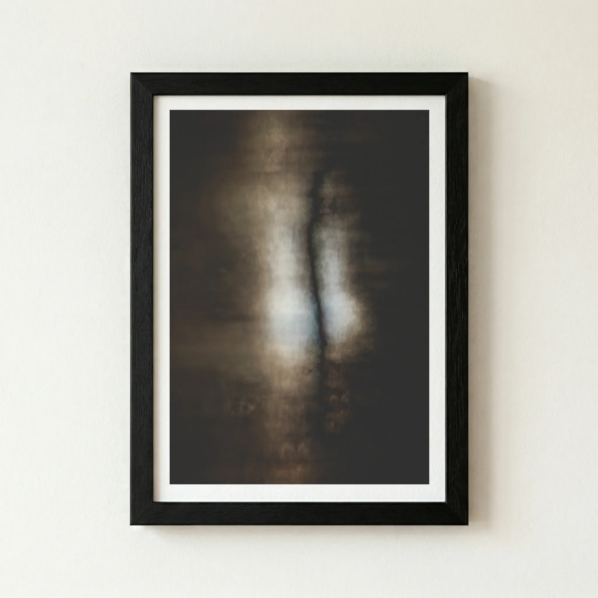 The 'Creation' abstract print in a black wooden frame, enhancing the dramatic contrast and making the central glowing elements appear more intense.