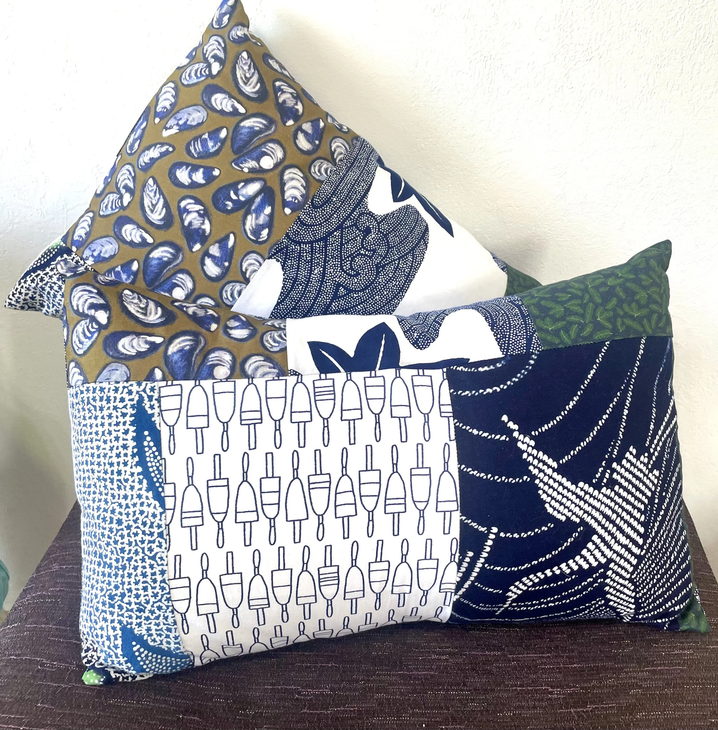 Two patchwork pillows by Carina Cilluffo