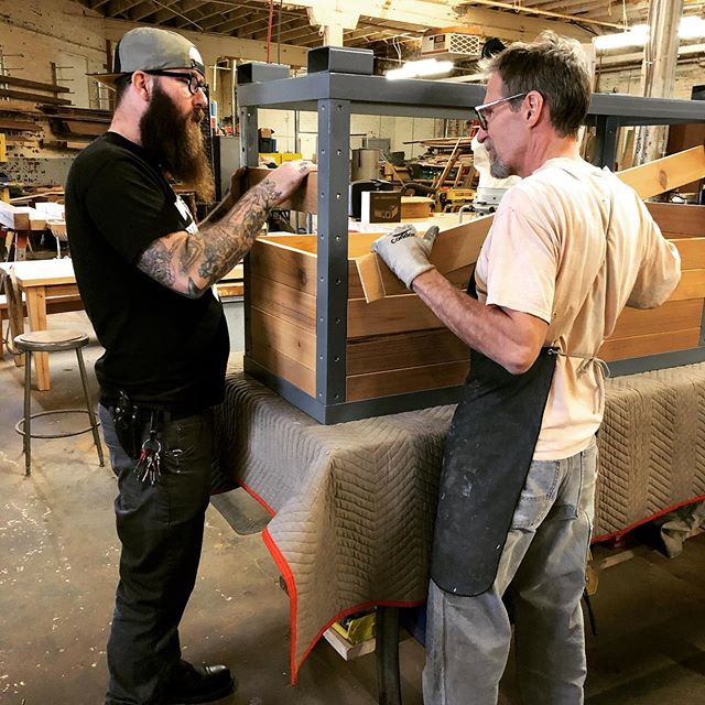 Eddie and Mike assembling planters for the new @littlefoxstl