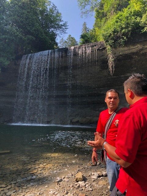 Kevin Eshkawkogan who heads up Indigenous Tourism Ontario and Steve Antoine of the Great Spirit Circle Trail at Bridal Veil Falls on Manitoulin Island 