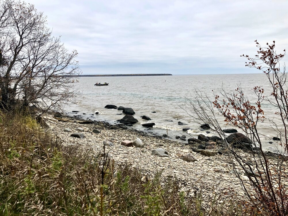 Fisherman checking nets off the shores off Hecla, Manitoba.