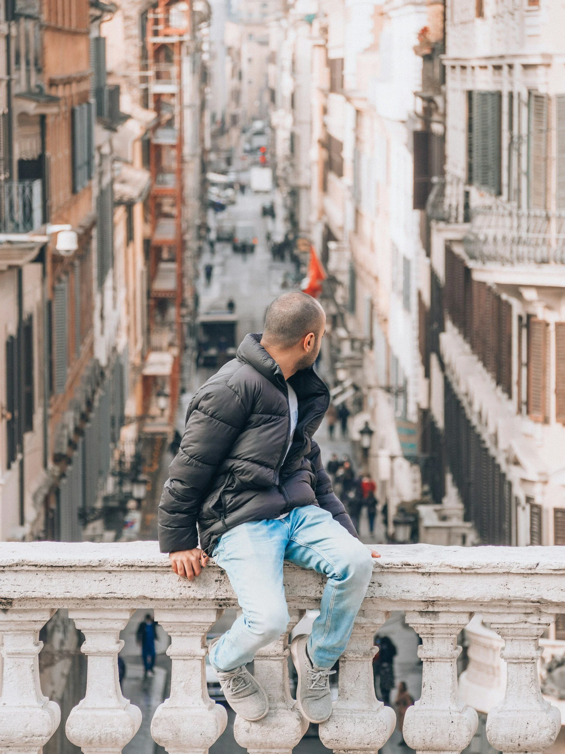 Traveler overlooking a historic European street