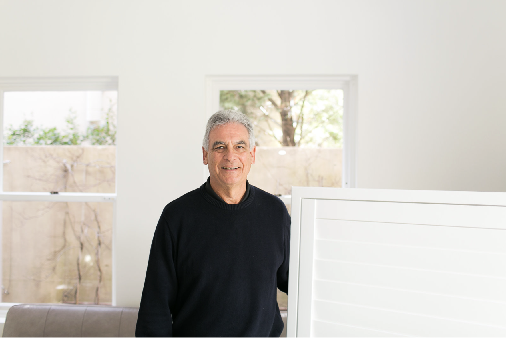 Selwyn Brest installing custom shutters in Sydney