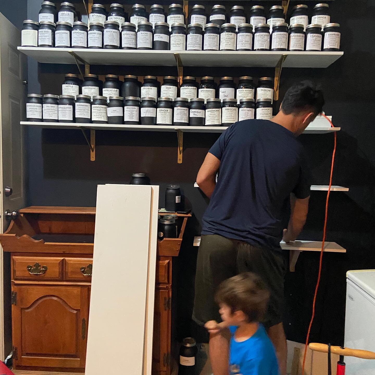 Who knew how many shelves it takes to be a herbalist?
.
Ok, jokes aside, these two fellas are my biggest cheerleaders and helpers (ok.. in all honestly mostly the taller one is helpful at this point 😝) and I love them to bits.
.
We have been putting