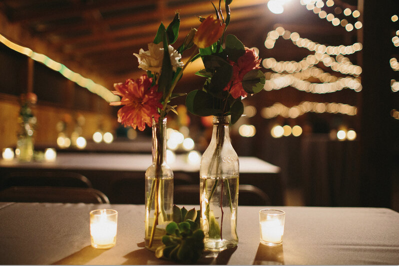 catie becker wedding inside barn flowers.jpg