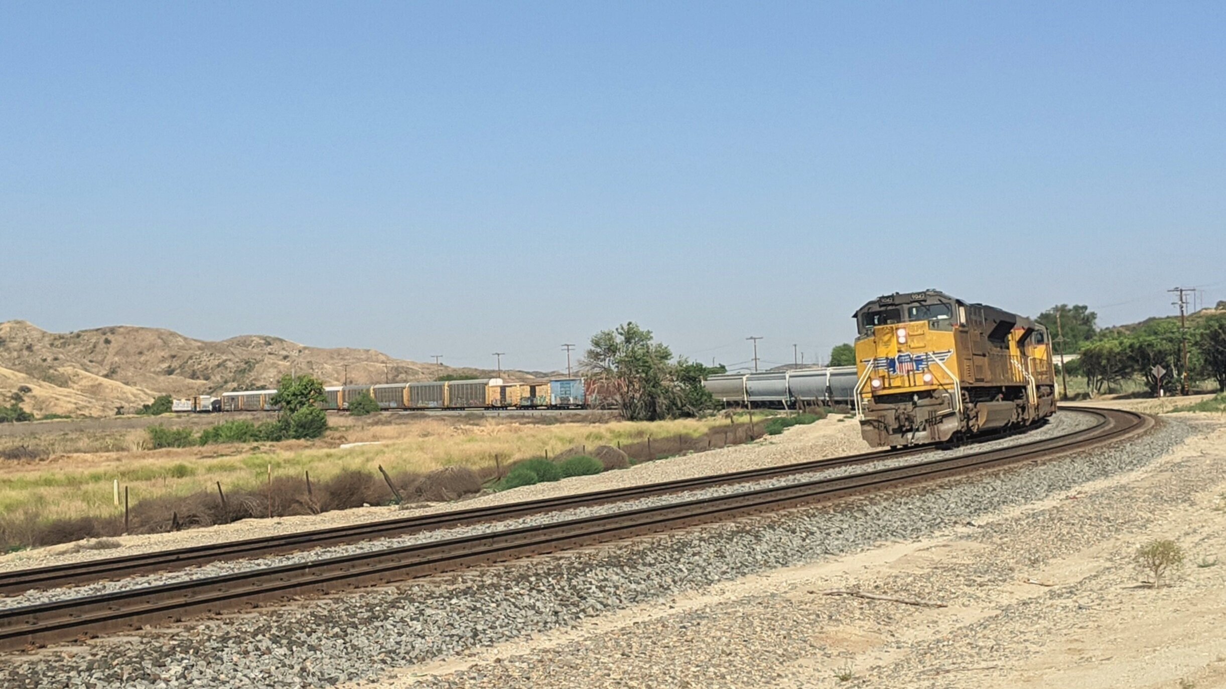  A Union Pacific manifest freight descending through the San Timoteo Canyon, near El Casco Lake, CA. Photo by Alex Lewis, 2020. 