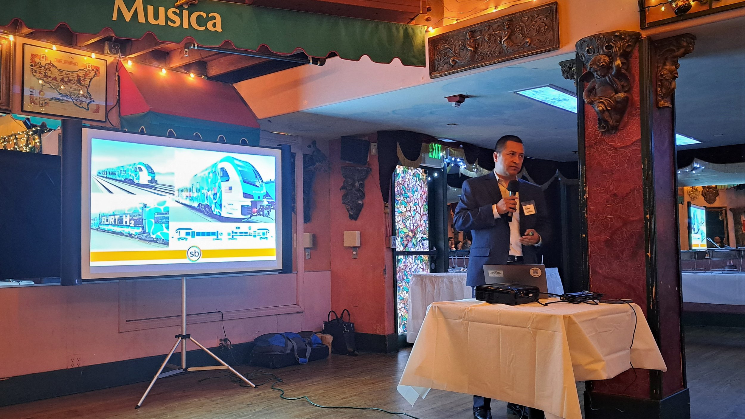  Victor Lopez from SBCTA presents on the Stadler Zero-Emissions Multiple Unit slated to enter service on the Redlands - San Bernardino Arrow service in 2024.  (Photo Credit: Alex Lewis, 2023) 