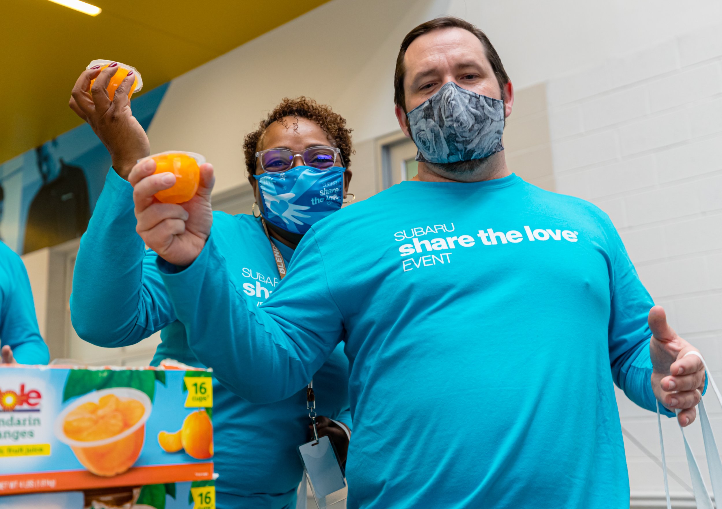 Subaru-close-up-of-food-bank-sorting-oranges-12.21.jpg