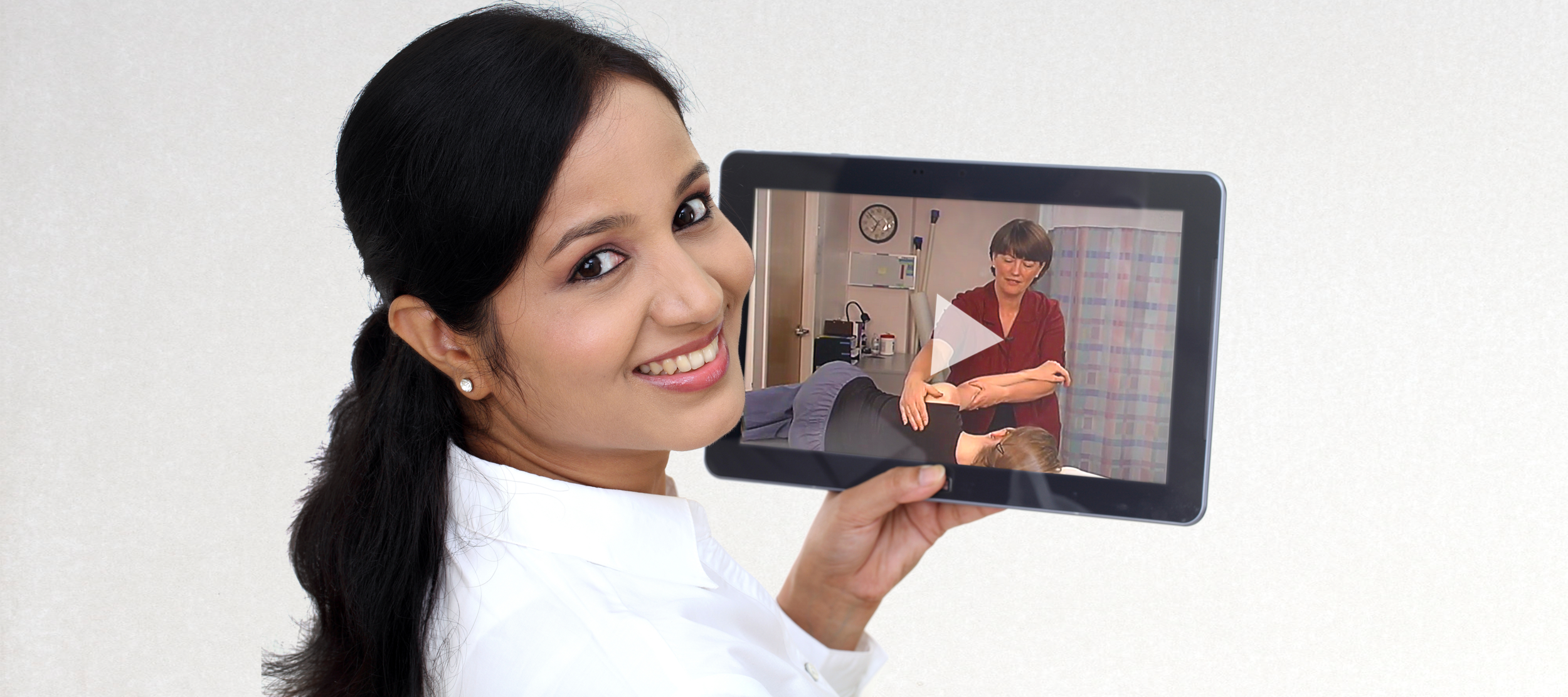 Girl with iPad grey wide vibrant.png