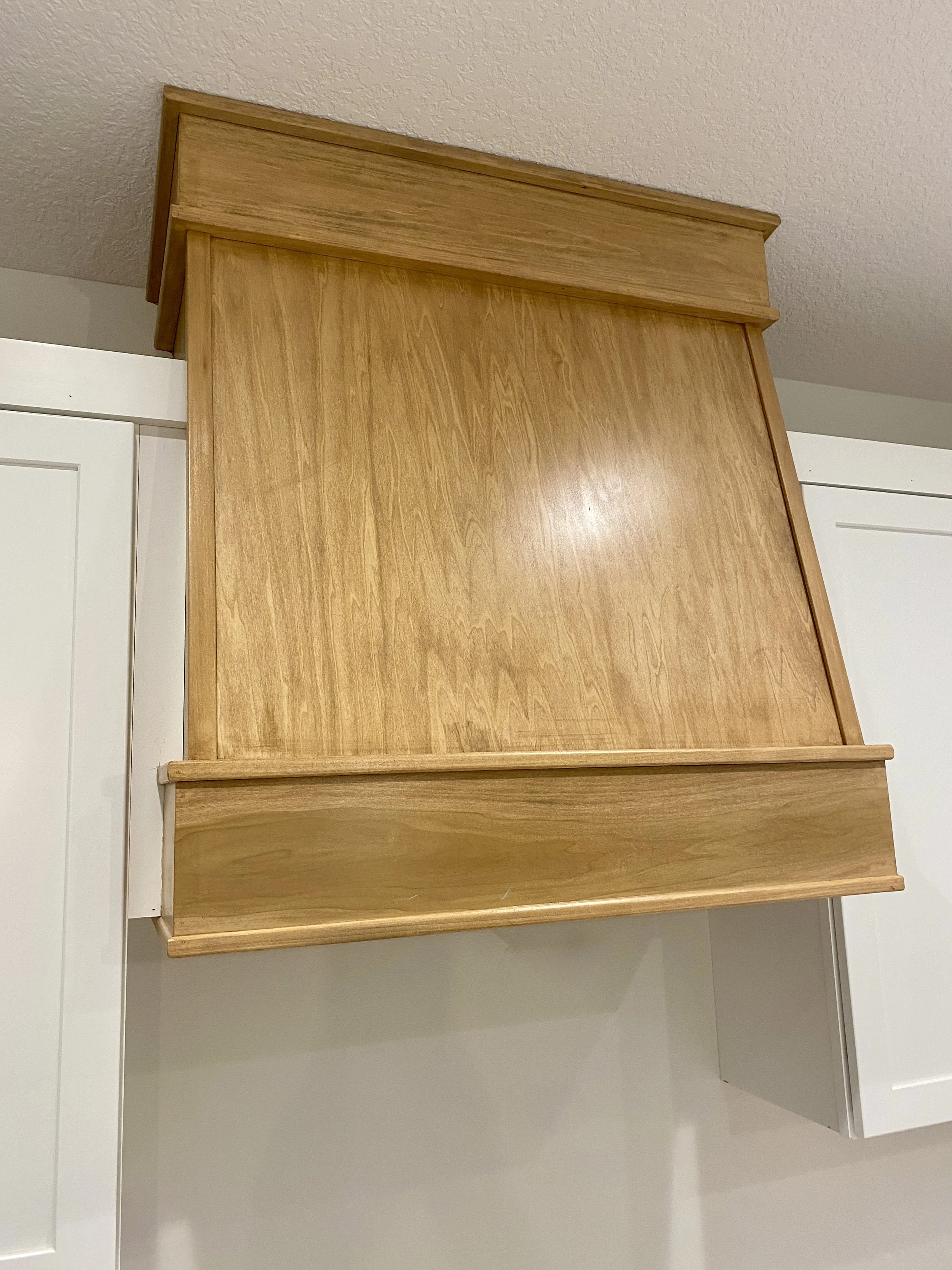 Custom built range hood to match kitchen island