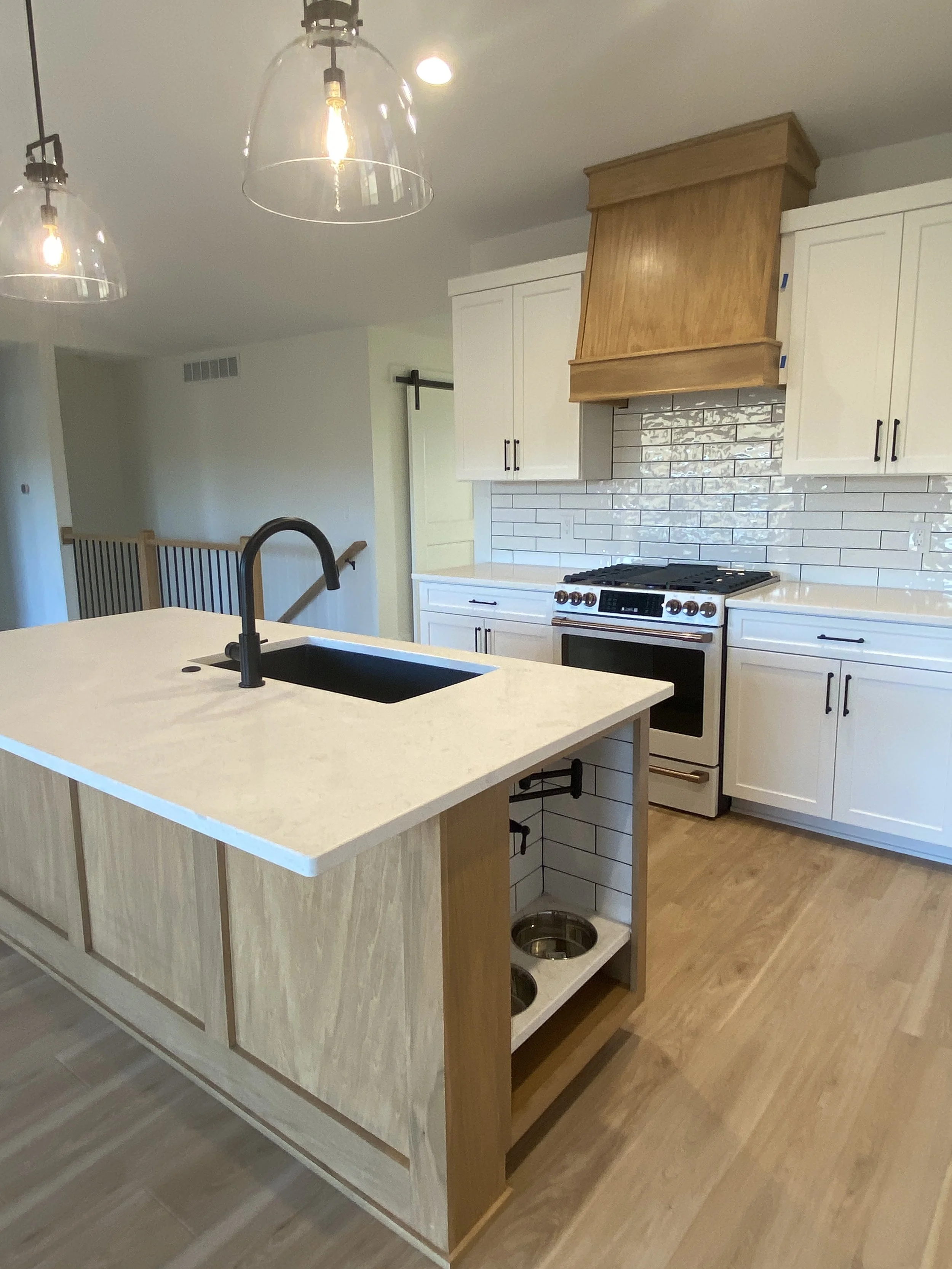 White kitchen stained hood.JPG
