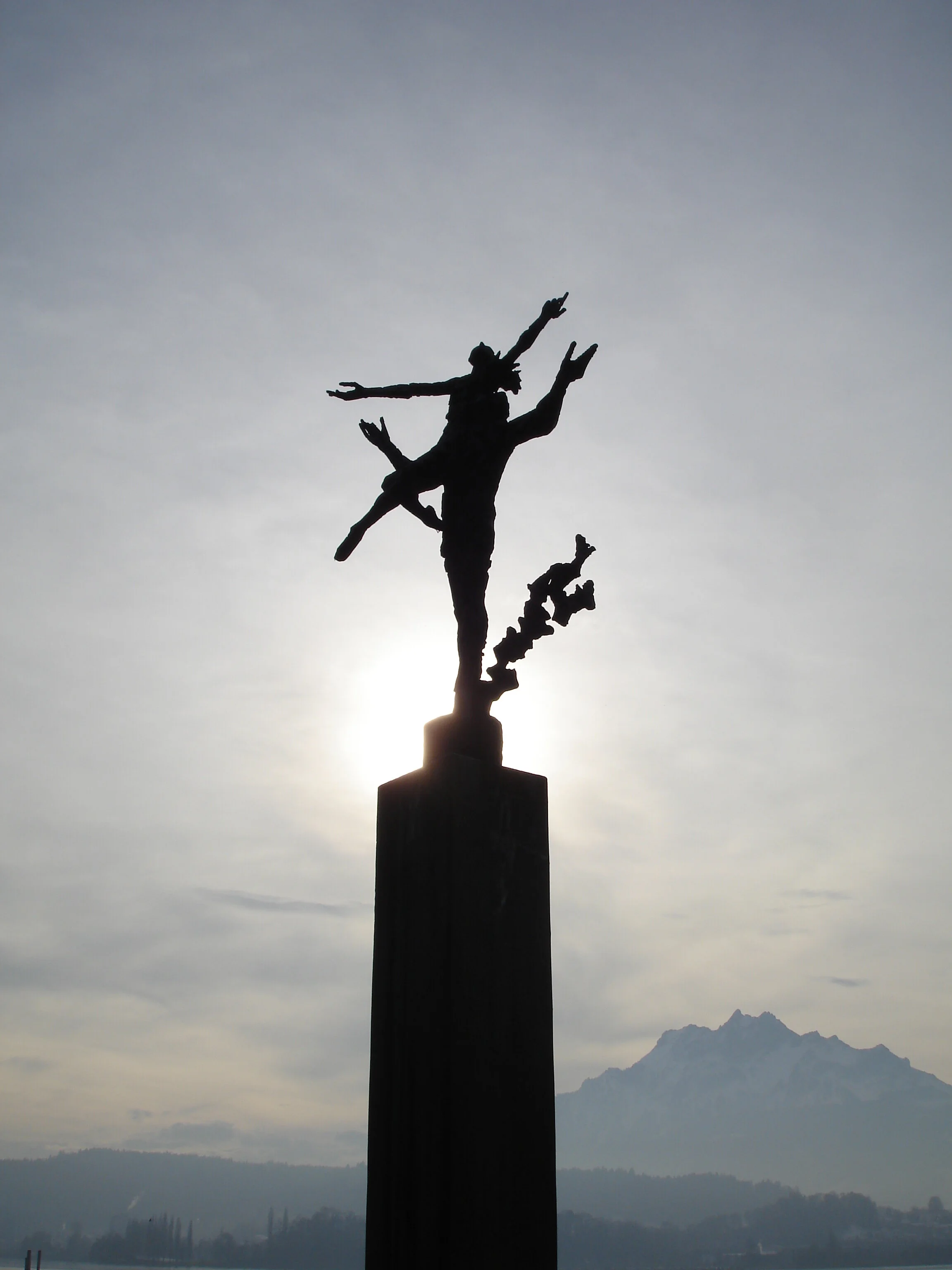  THE DANCERS IN THE SPOTLIGHT AS THE WINTER SUN PREPARES TO SET BEHIND PILATUS,  LUZERN, SWITZERLAND 