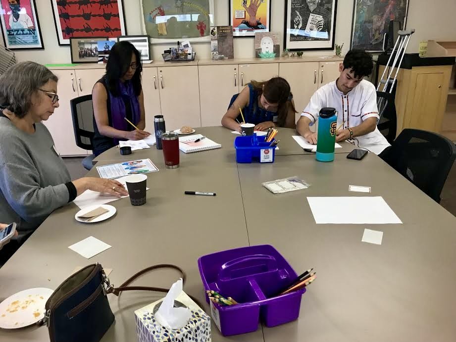 Summer 2019 - Students work on sketches for the mural with Alicia Sui.