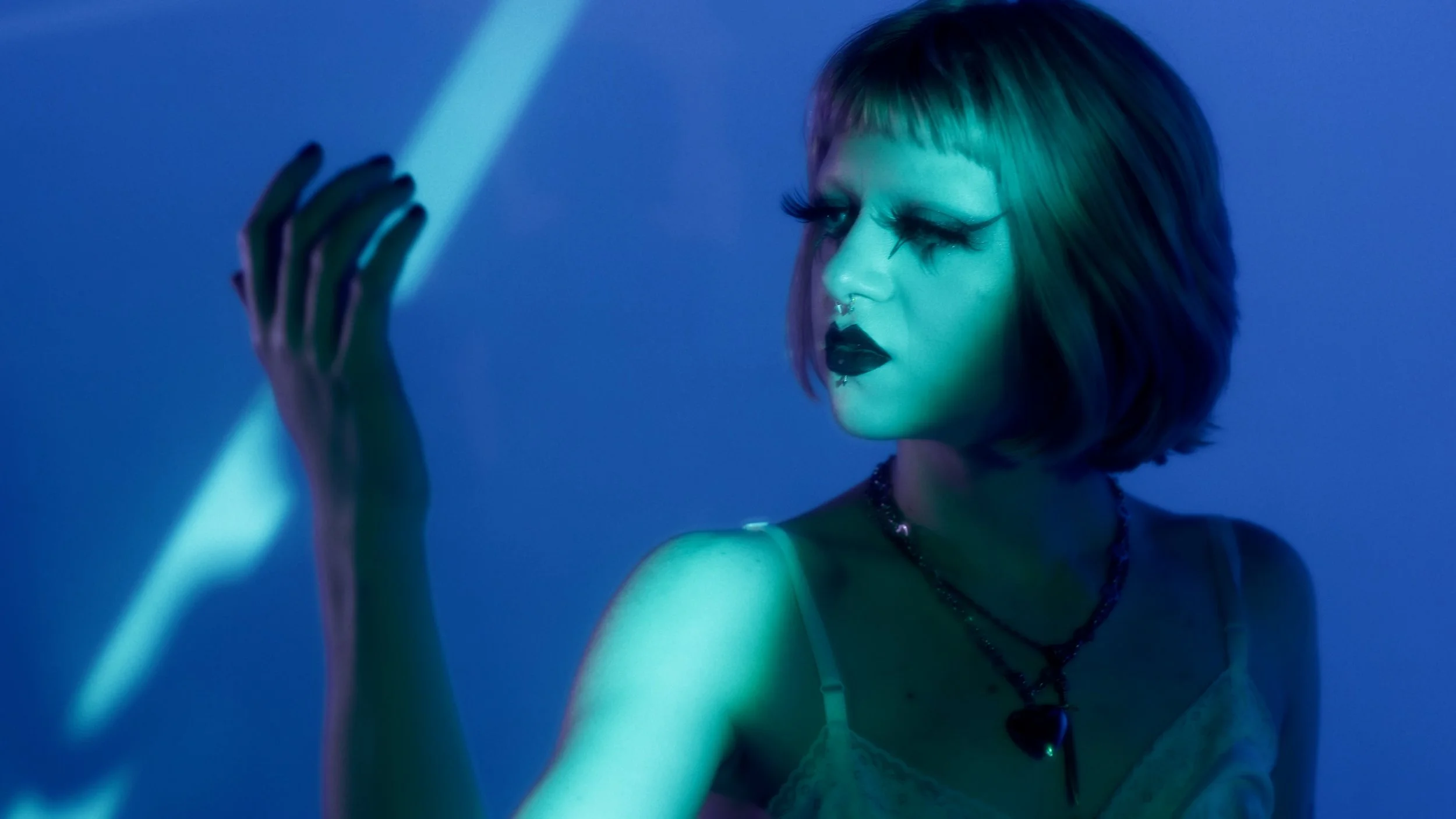 In Mills’ second collaboration with Deaf dancer Lark Detweiler, this time for Detweiler’s solo music project, the two play in pure gothic delight in this music video for spiralteeth’s first single “Ladyofthelake.” Alice Teeple of Post-punk.com wri