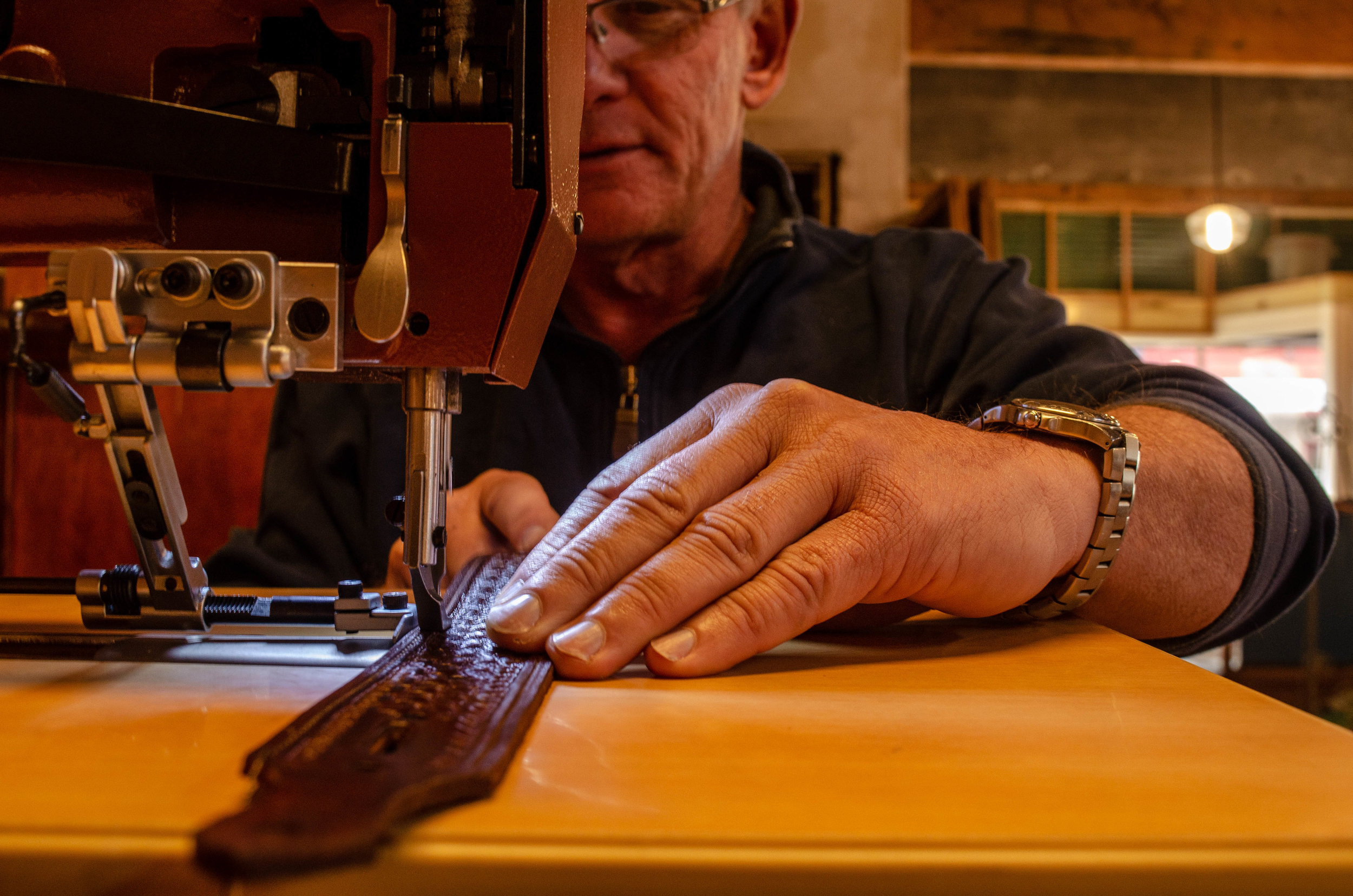 Belt sewing at Alden's School of Leather Trade