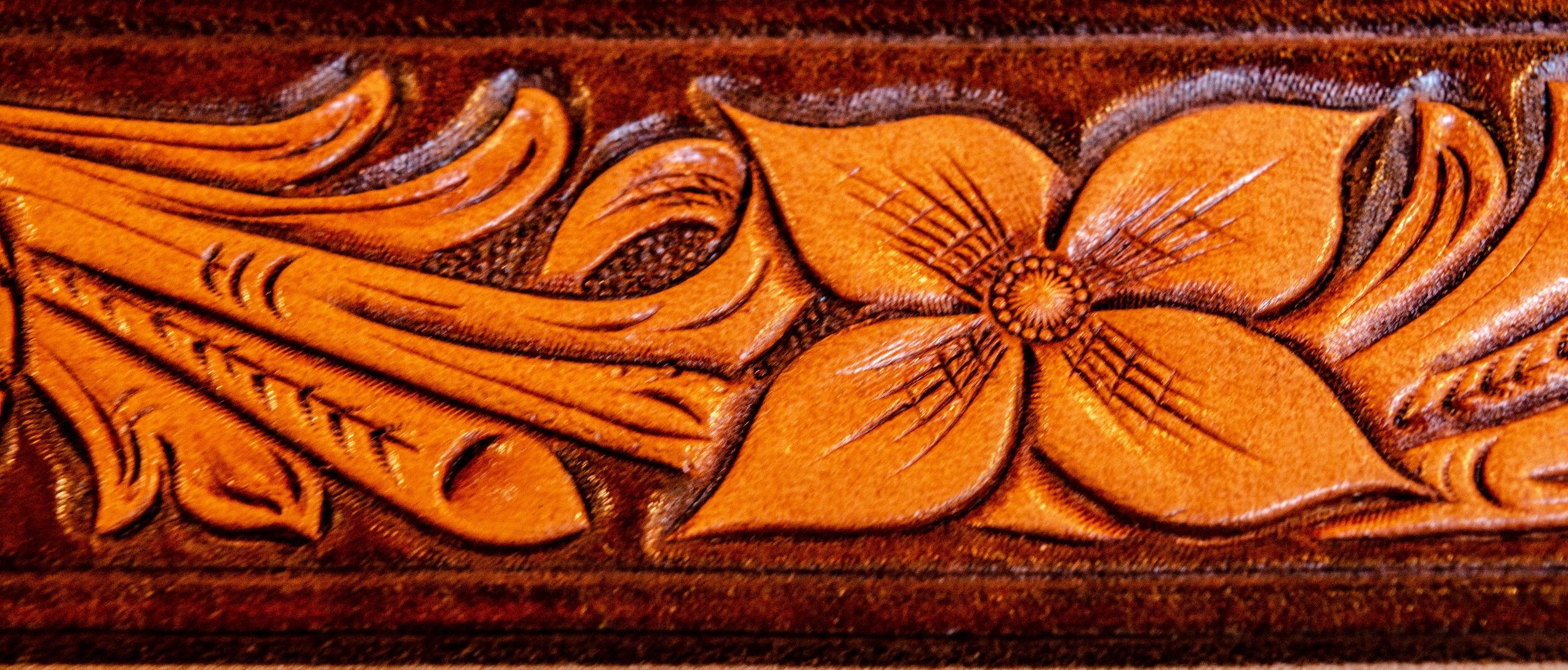 Floral carved belt by Alden's School of Leather