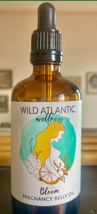 Bloom pregnancy belly oil label showing natural plant-based ingredients — handmade by Wild Atlantic Wellness in Ballydehob West Cork
