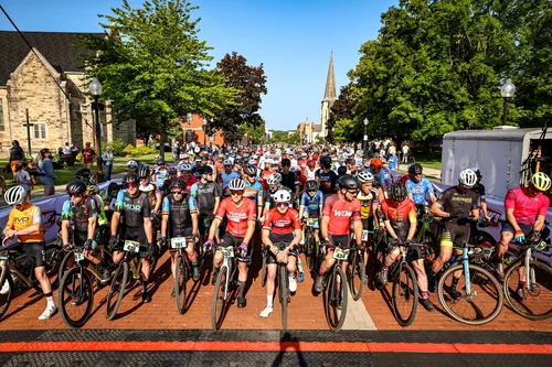 Cow Pie Classic riders line the street to pose before a race