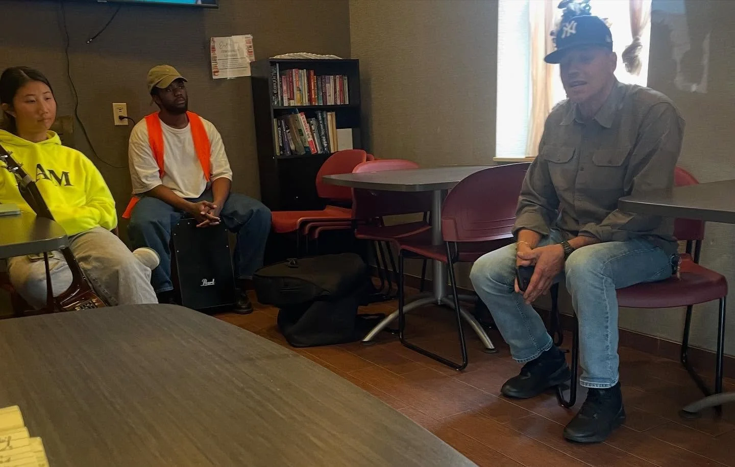 Pastor Javie bringing a word to one of our outreach locations.