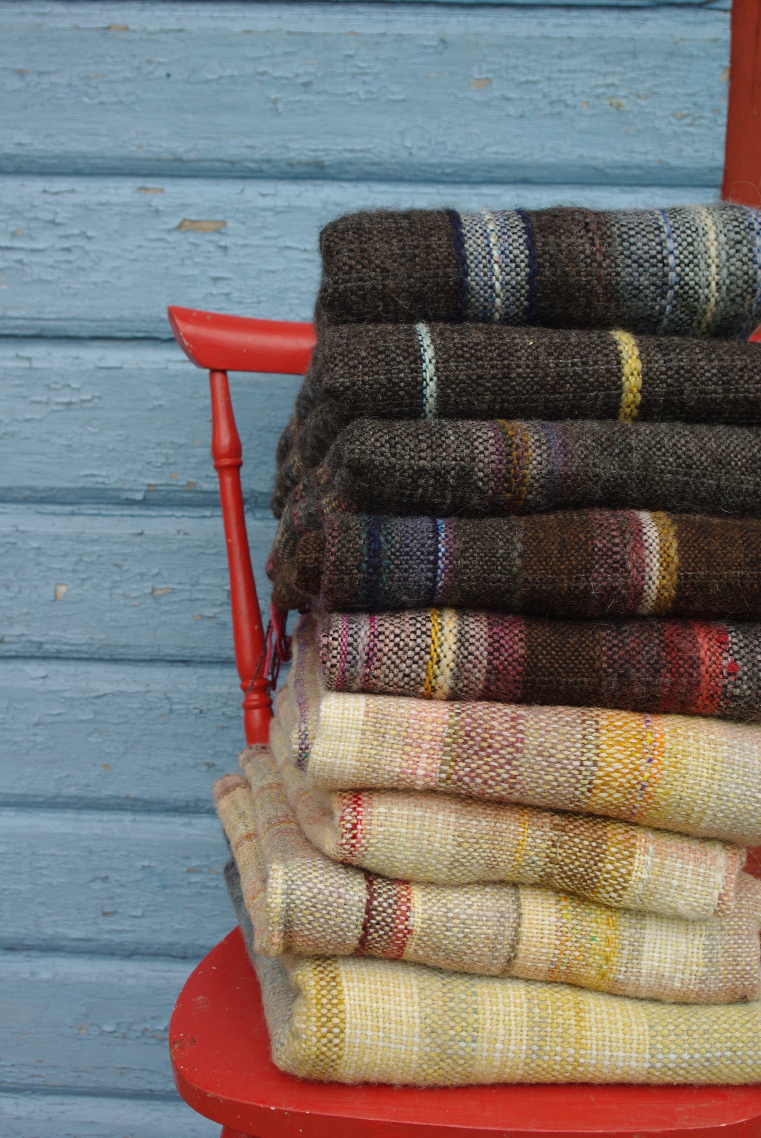 A pile of handwoven woolen throws