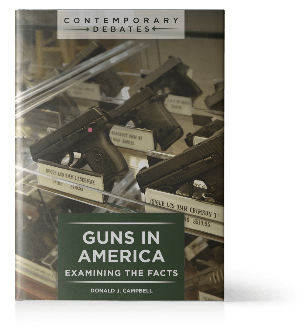 Book titled "Guns in America: Examining the Facts" by Donald J. Campbell, with firearms displayed in a glass case on the cover.