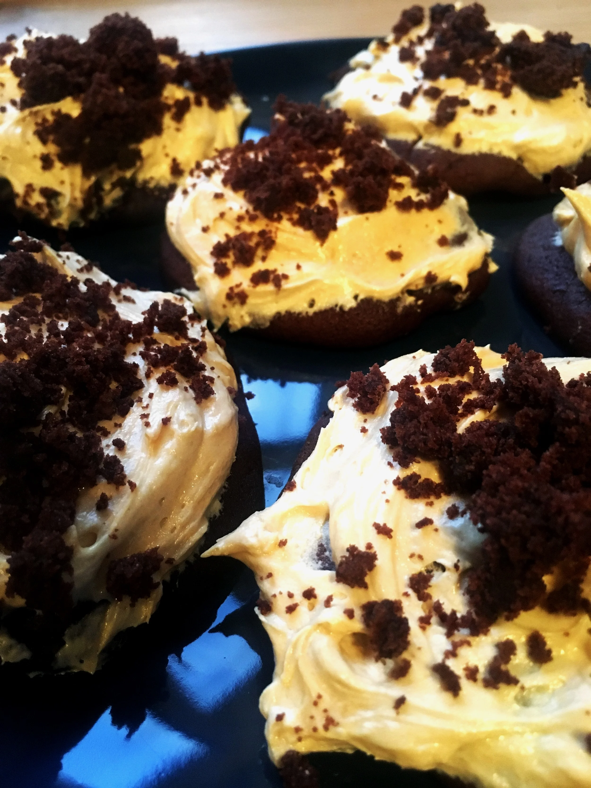 Vegan double chocolate cookies with non - vegan salted caramel frosting
