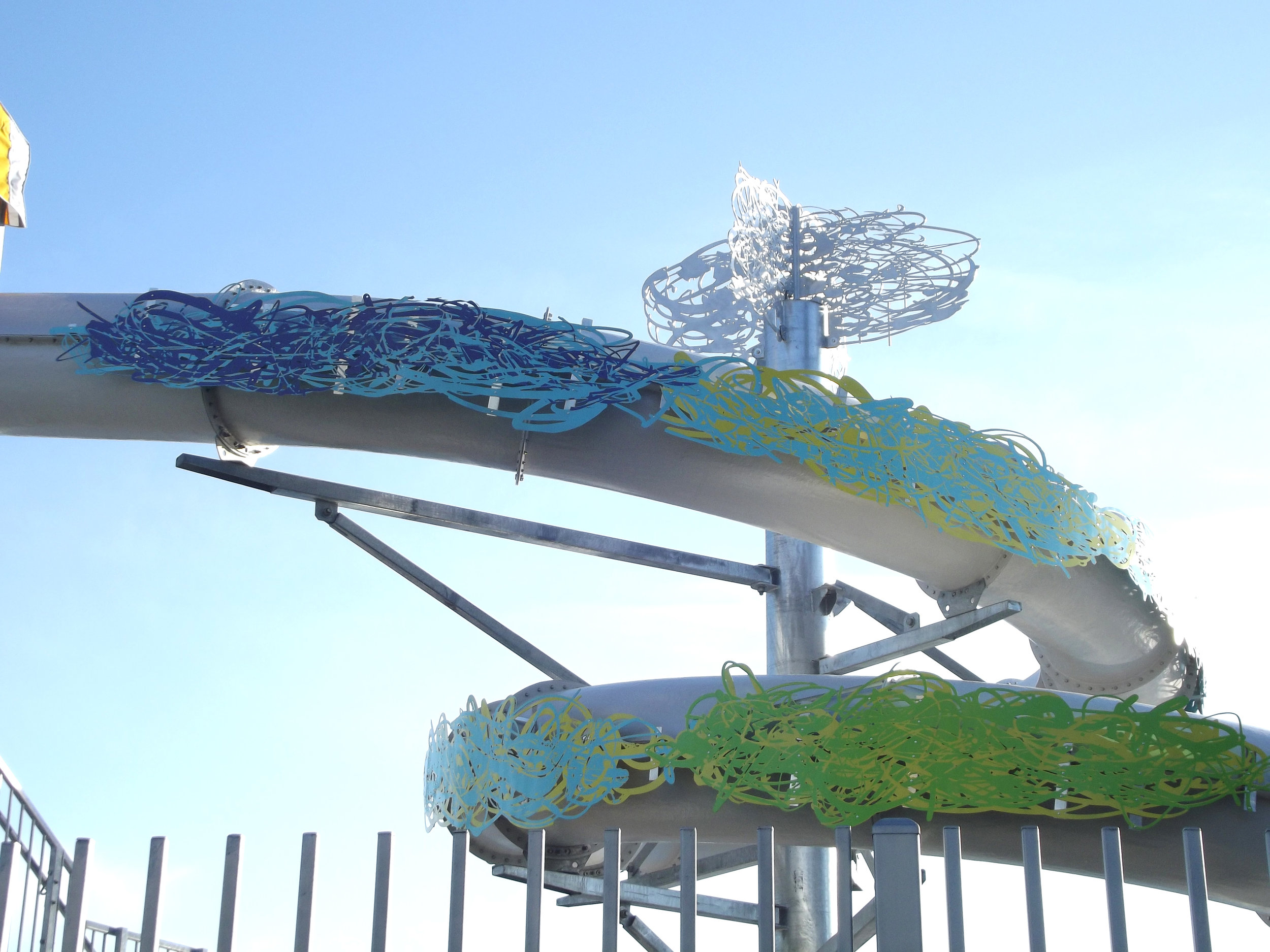 “Cycles and patterns” 2012 Public art for the La Alma Recreation Center. Located at 11th and Osage in Denver CO. CNC routed aluminum panels and paint