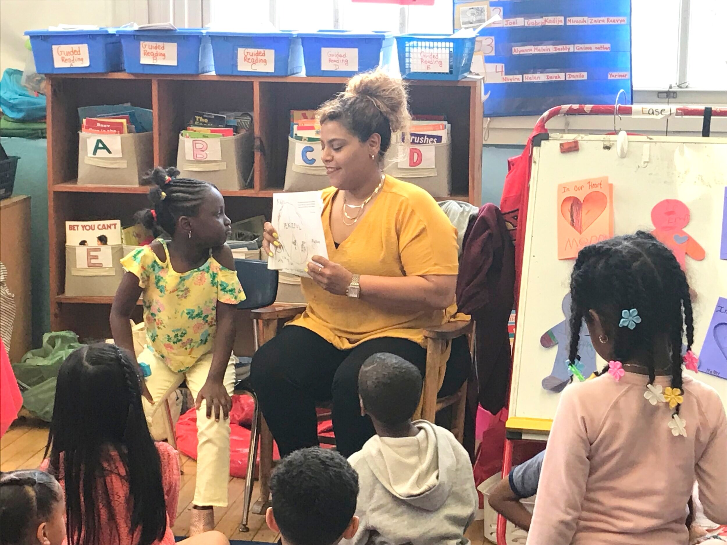 Teacher Reading to HPAC children