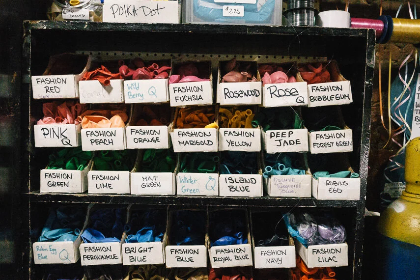 Balloons organized by color in the Balloons To Go shop in Chelsea, NYC