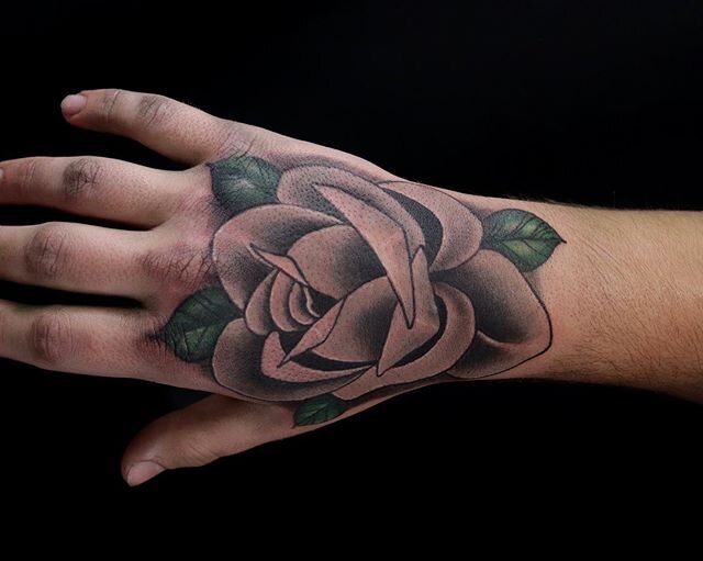 A grey hand rose by Justin. Just over here bein&rsquo; clean and happy. #rose #rosetattoo #handrosetattoo #greyrose #handtattoo #eternalink #cheyennetattooequipment #sgf #springfieldmo #417 #fuckcoronavirus🍻 #thebeardedladymo