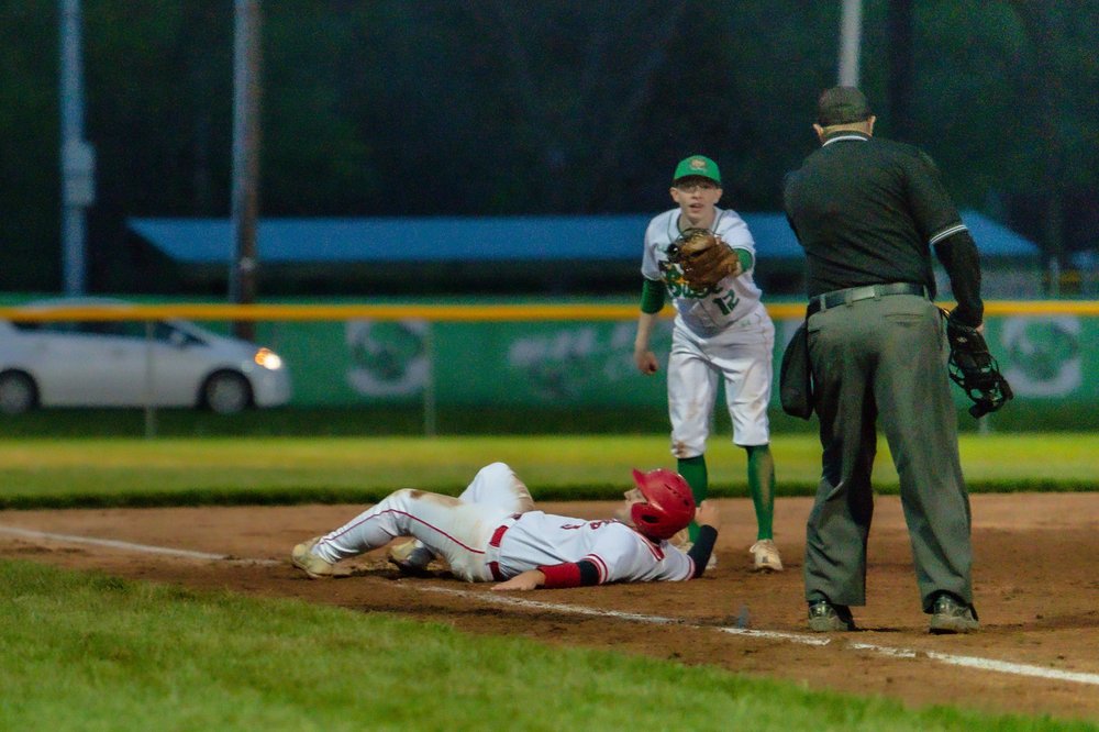 Sports — a close play at third base
