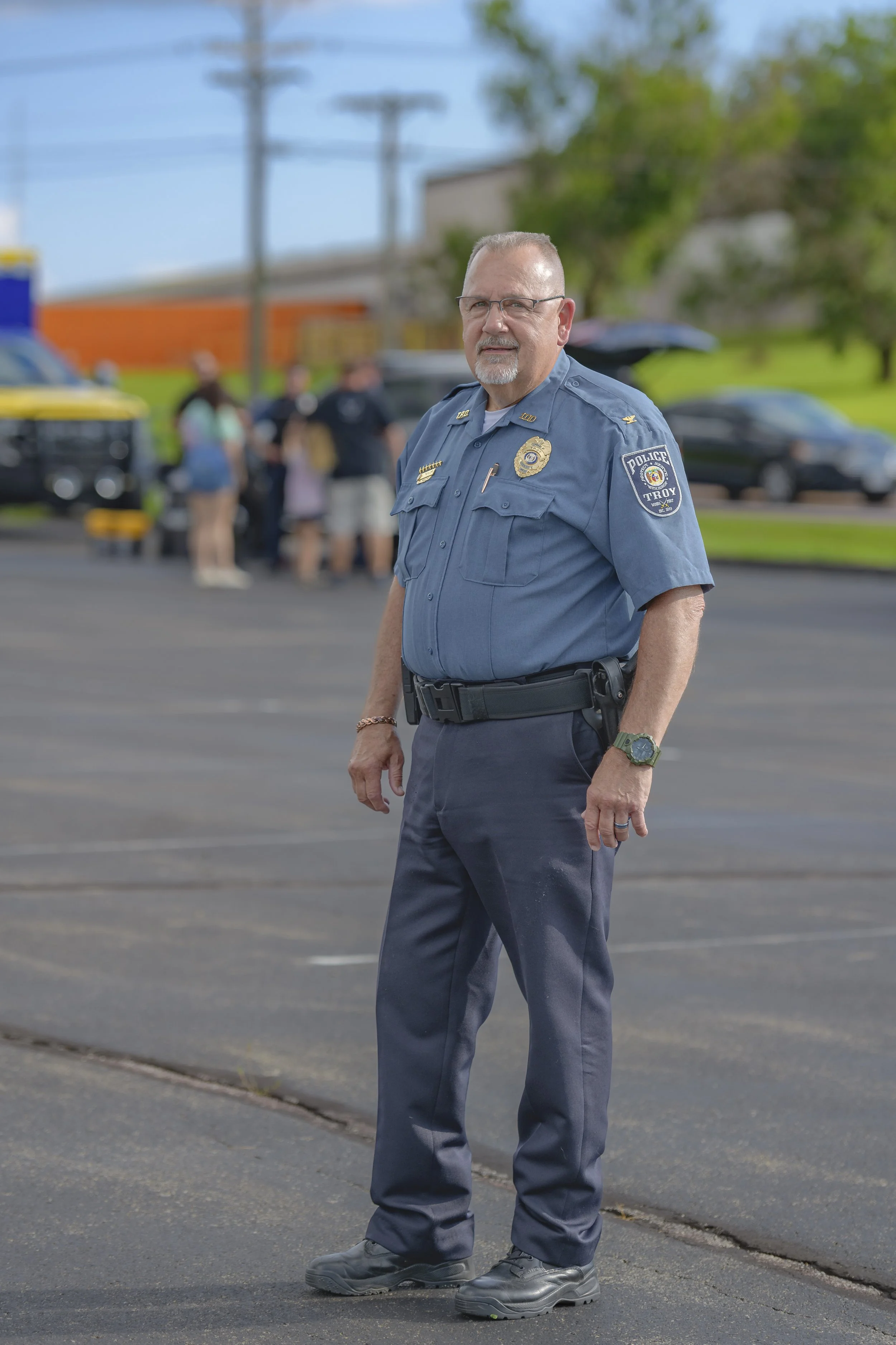 A uniformed officer stands in the parking lot during the 2022 National Night Out.