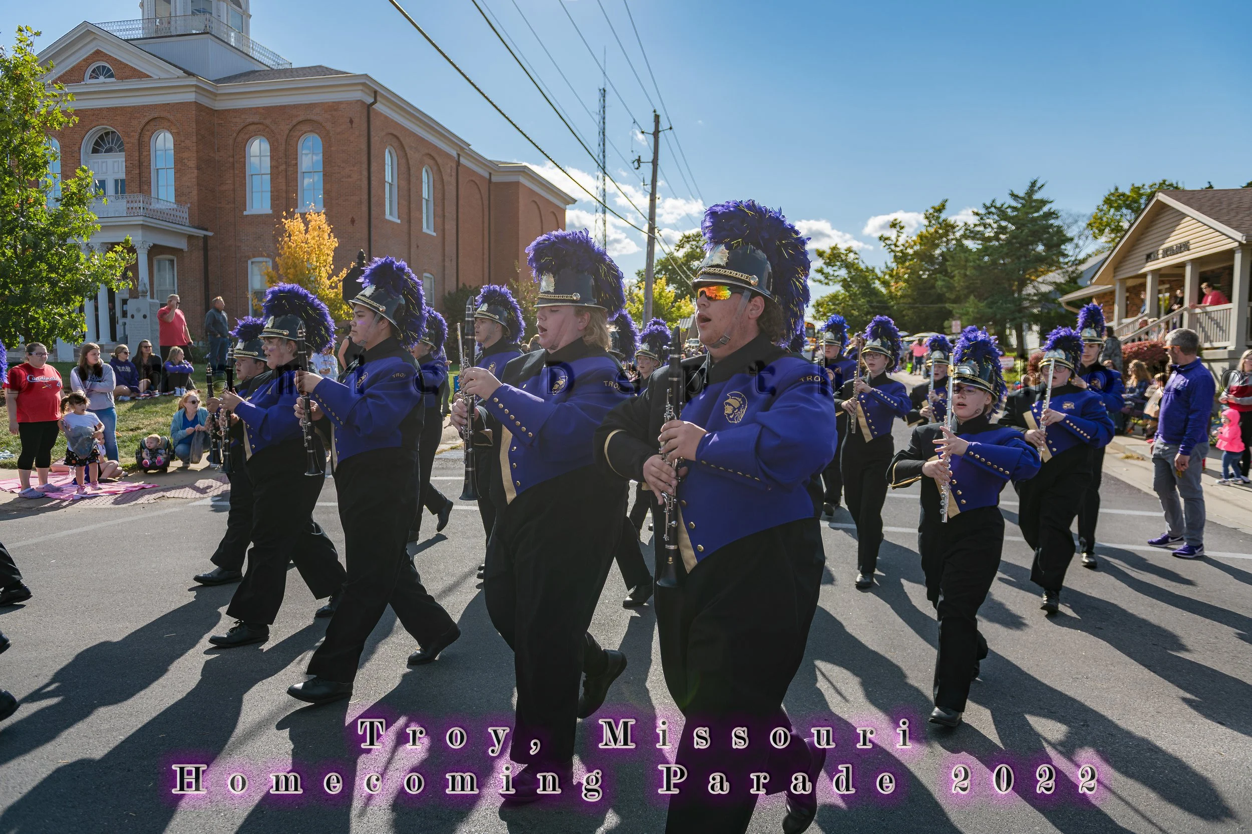 Woodwind players march in formation along the street during the 2022 Troy Homecoming Parade.