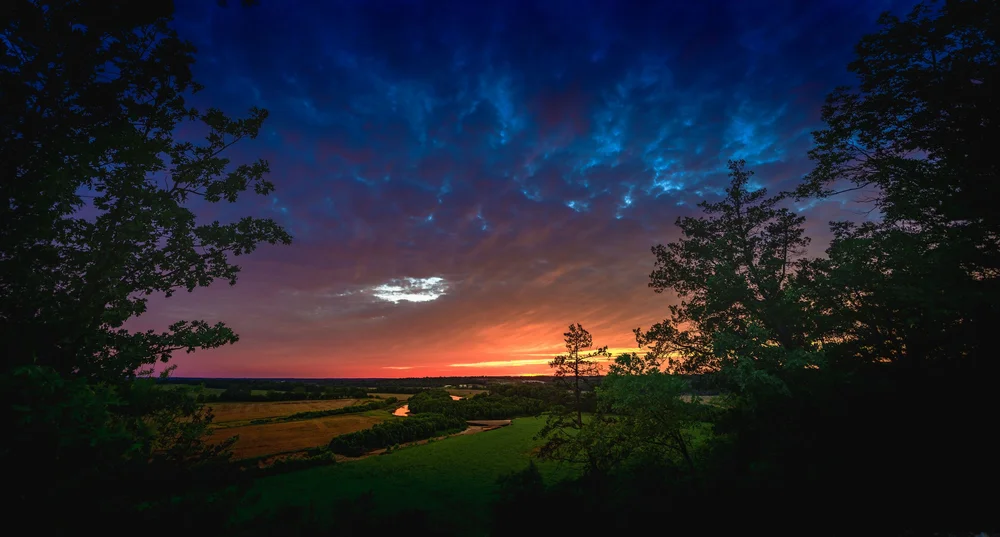 Landscapes — fields beneath a vivid sunset