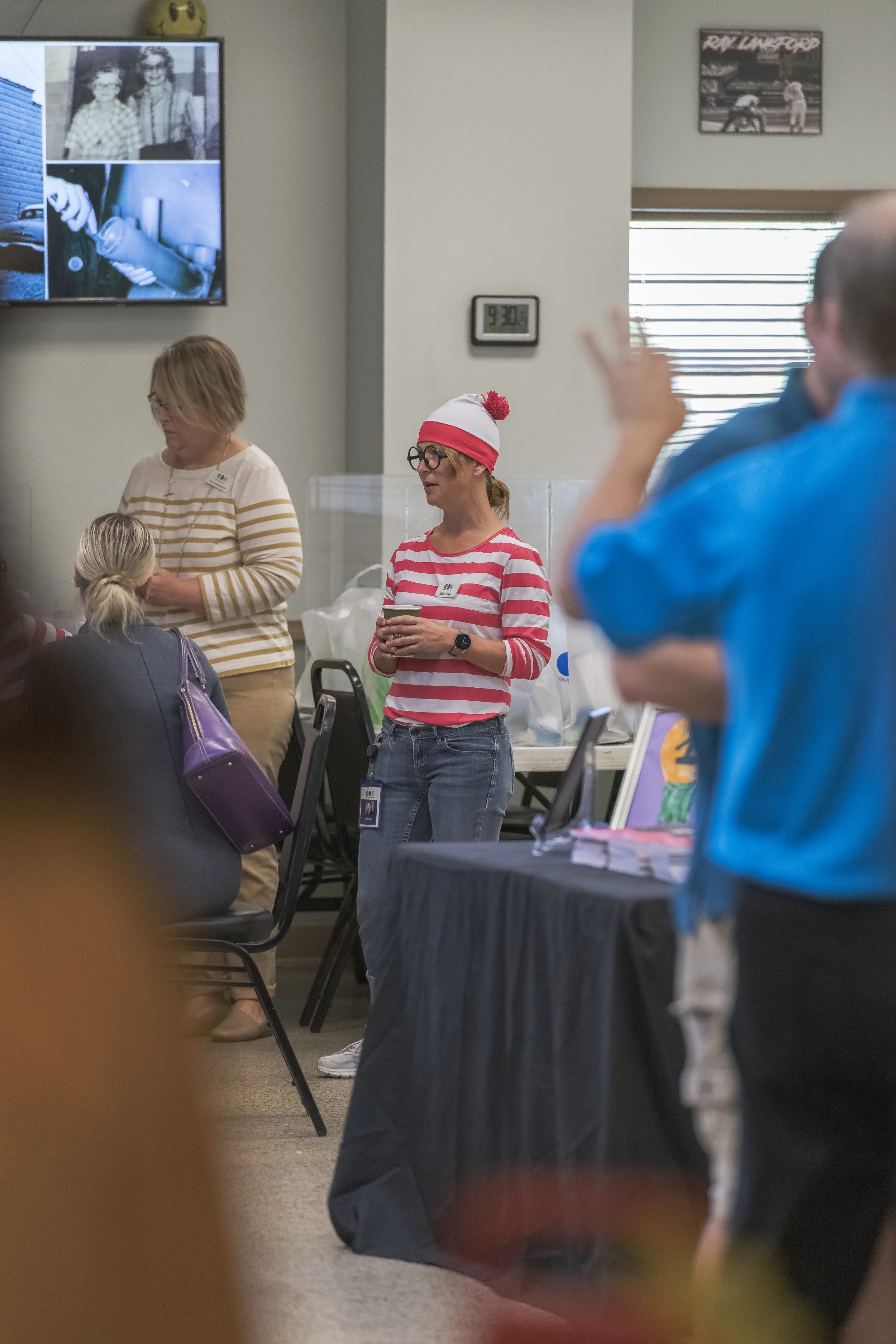 Visitors gather around an information table in the reception area at the 2022 BCI Open House.