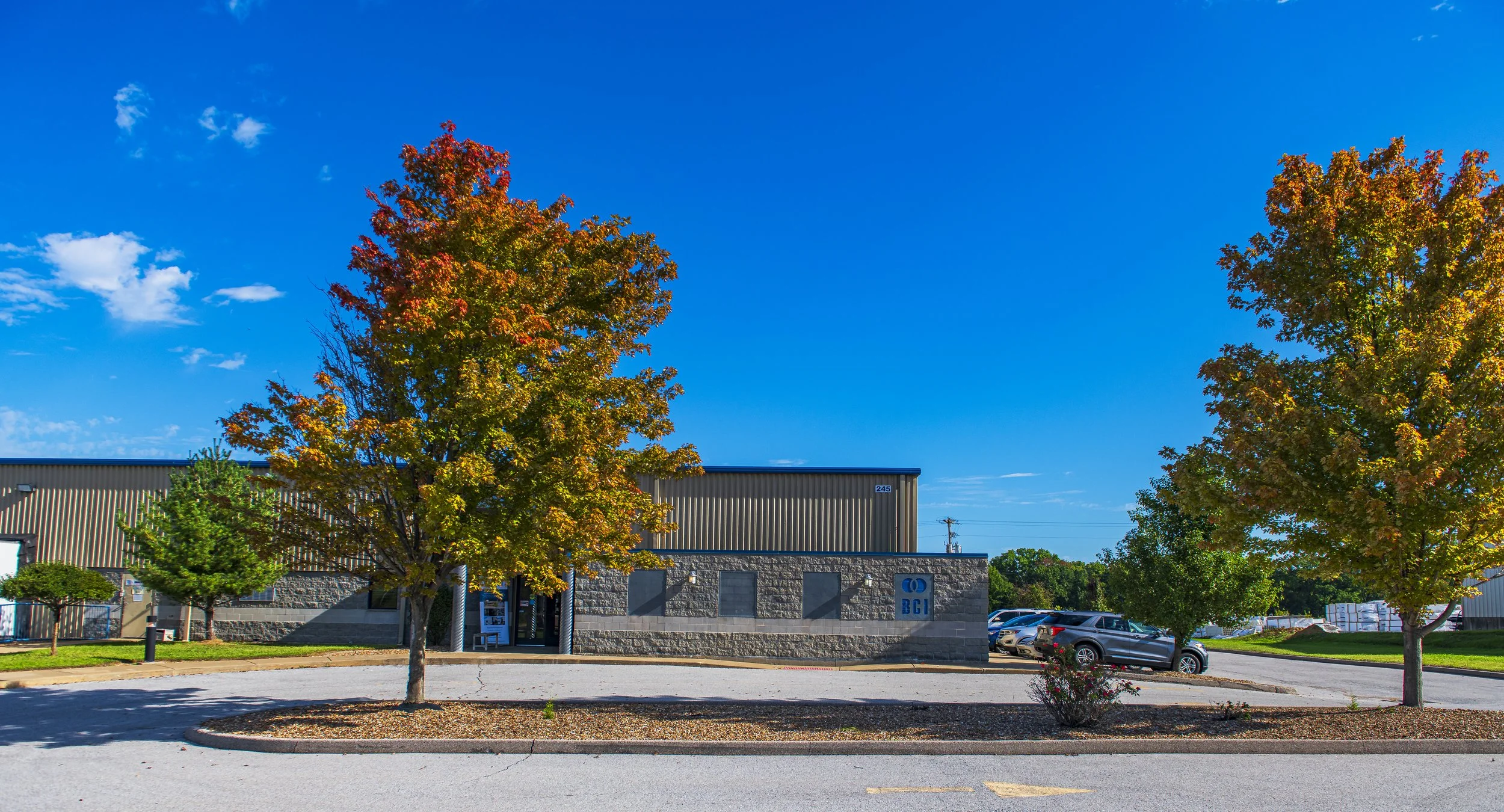 Autumn trees frame the building and parking lot at the 2022 BCI Open House.