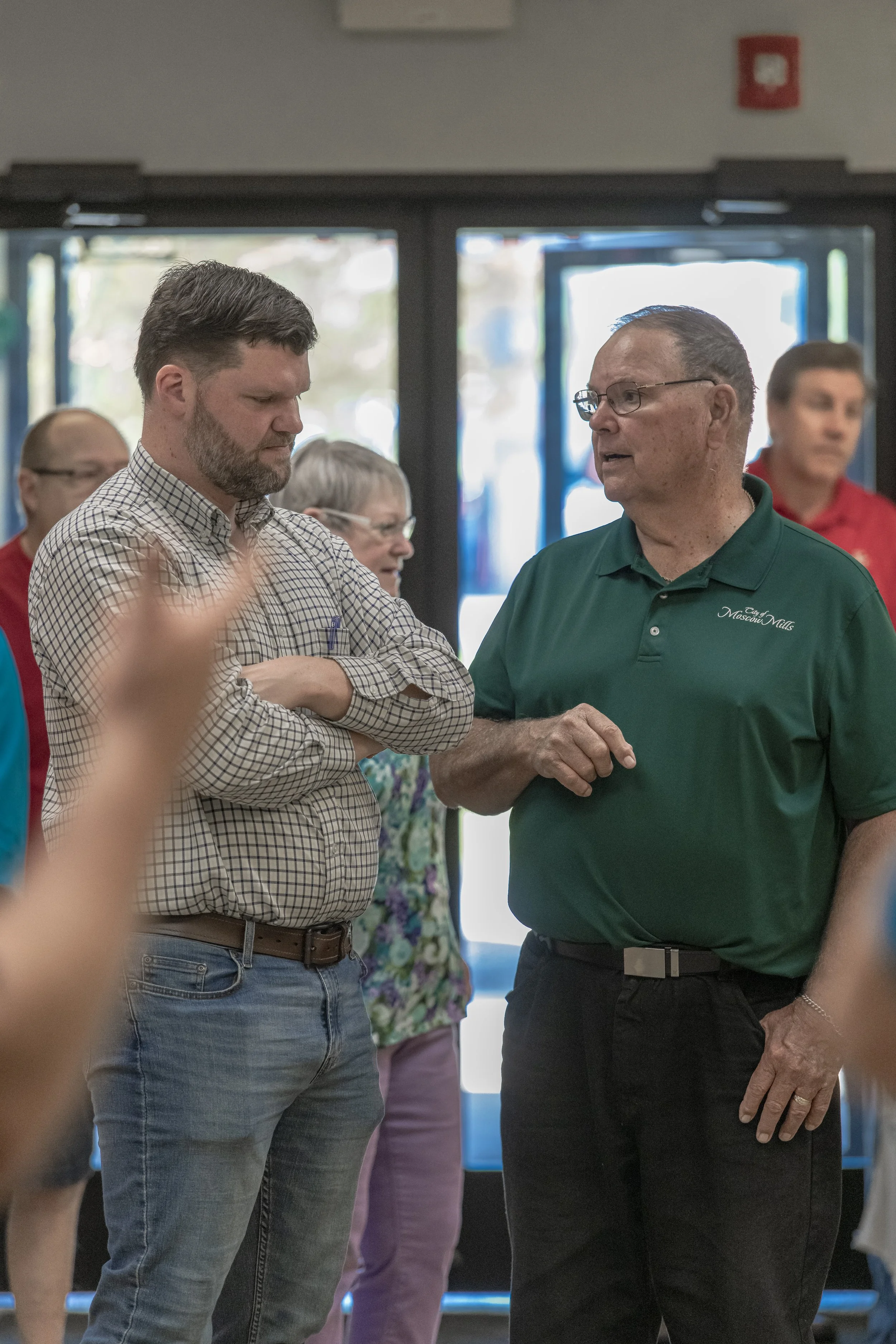 Two attendees talk near the entrance at the 2022 BCI Open House.