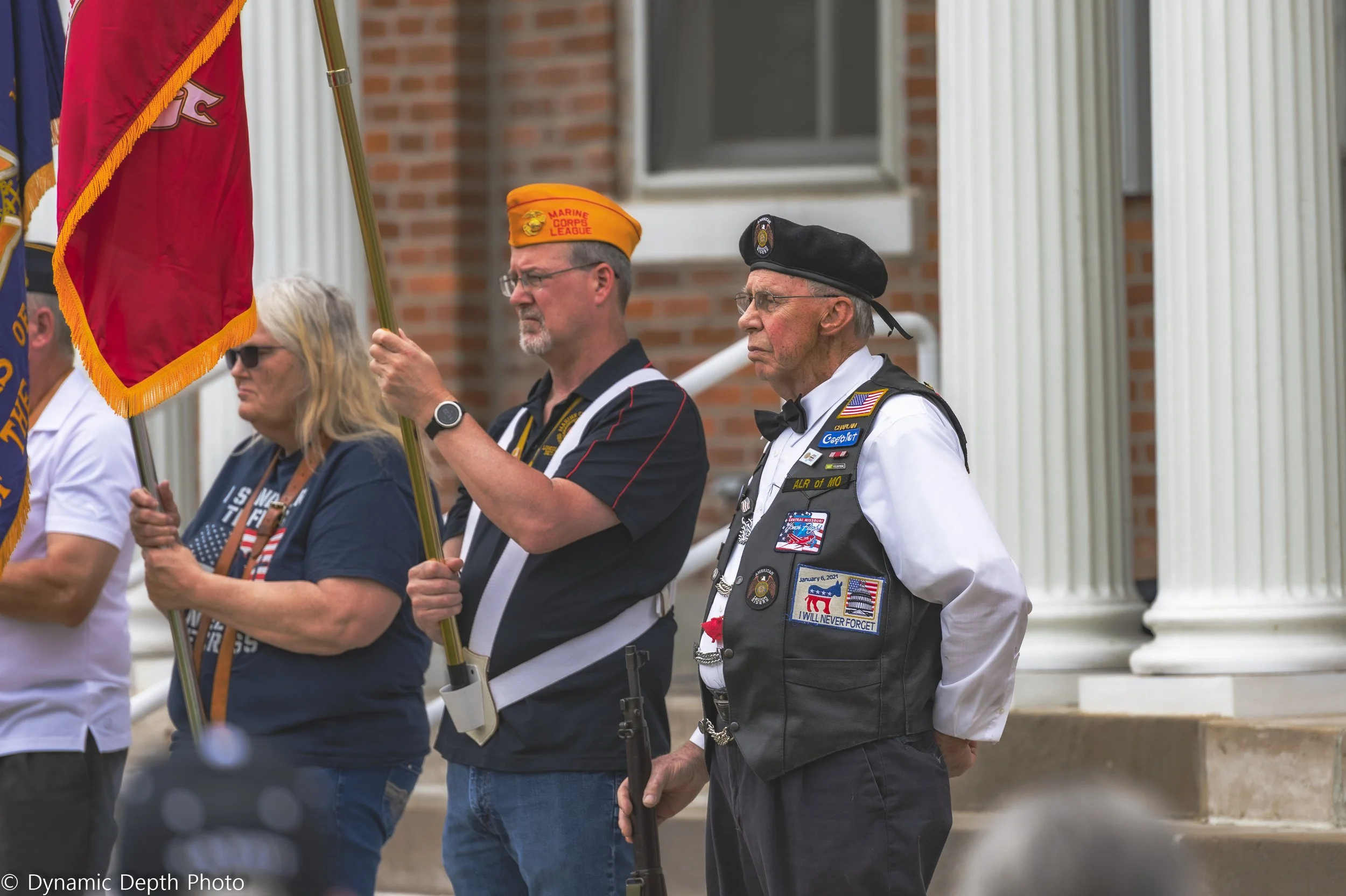 Flag bearers stand together near the white columns during the 2021 Memorial Day Service.