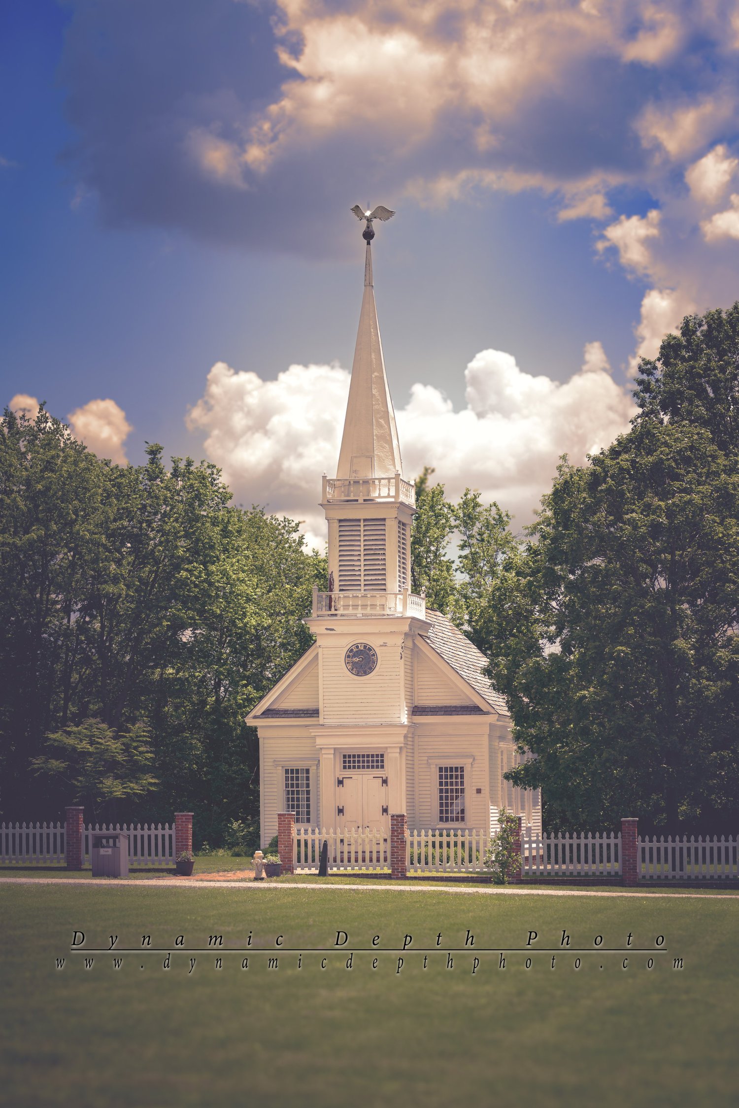 White Church with a Tall Steeple. Visible: white church, tall steeple, cross.