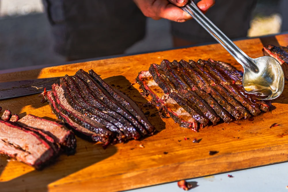 Food — sliced smoked meat on a cutting board