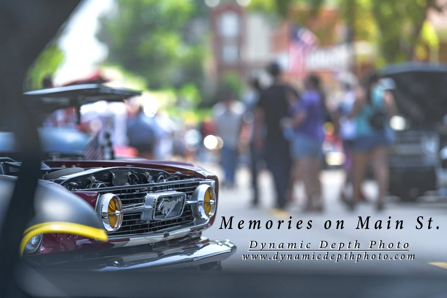 Dark Car Grille with Blurred Street Crowd. Visible: dark car, front grille, chrome trim.