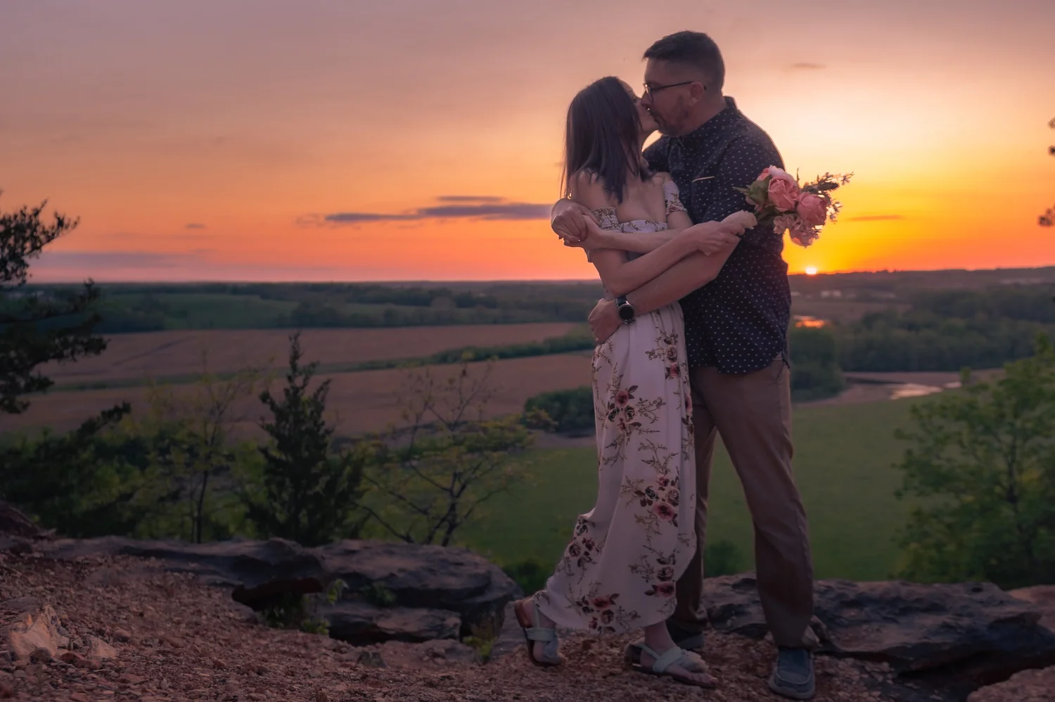 Two People Embracing at Sunset. Visible: two people, embrace, sunset.
