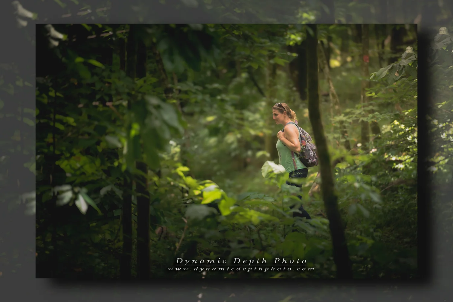 Portrait Among Woodland Leaves. Visible: outdoor portrait, woodland, green leaves.