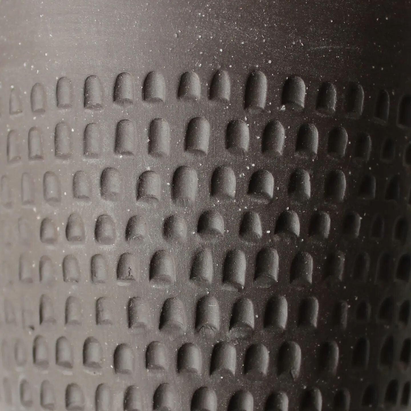 Detail of a black carved drinking vessel.

Texture for decoration, rather than glaze. 

#wheelthrownceramics #australianceramics #pottery #handmadeceramics #carvedtumbler #cremerging  #melbourneartist #madeinthornbury