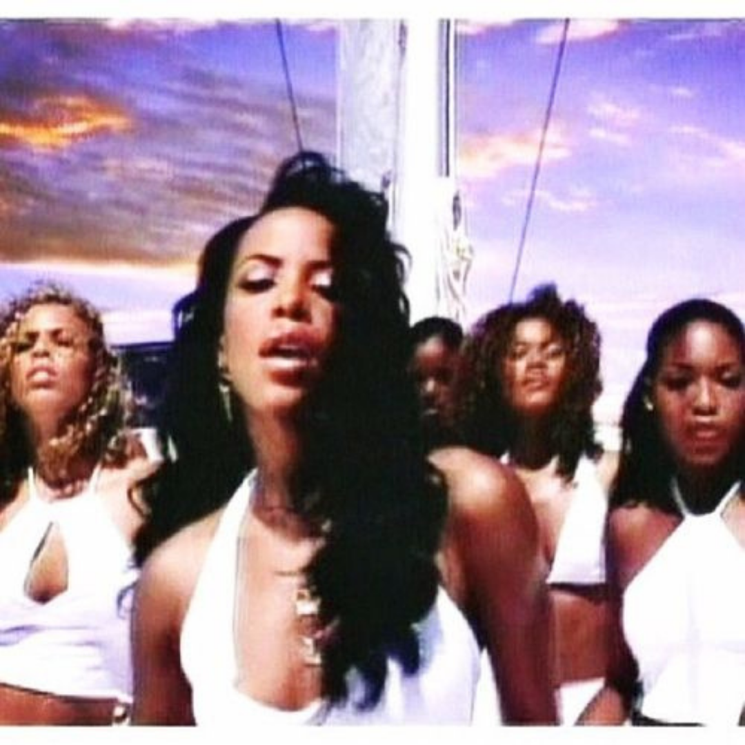Lisette Bustamante (Left) with Aaliyah and other dancers from the video “Rock The Boat” (Screen Capture)