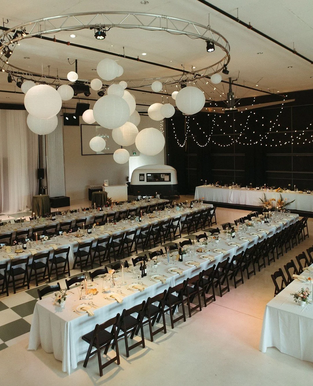 Creating a reception design is about more than aesthetics, it's about shaping the atmosphere for meaningful connection. Long tables invite conversation and give you the gift of seeing each of your loves ones' faces, no backs to you. 
When consider