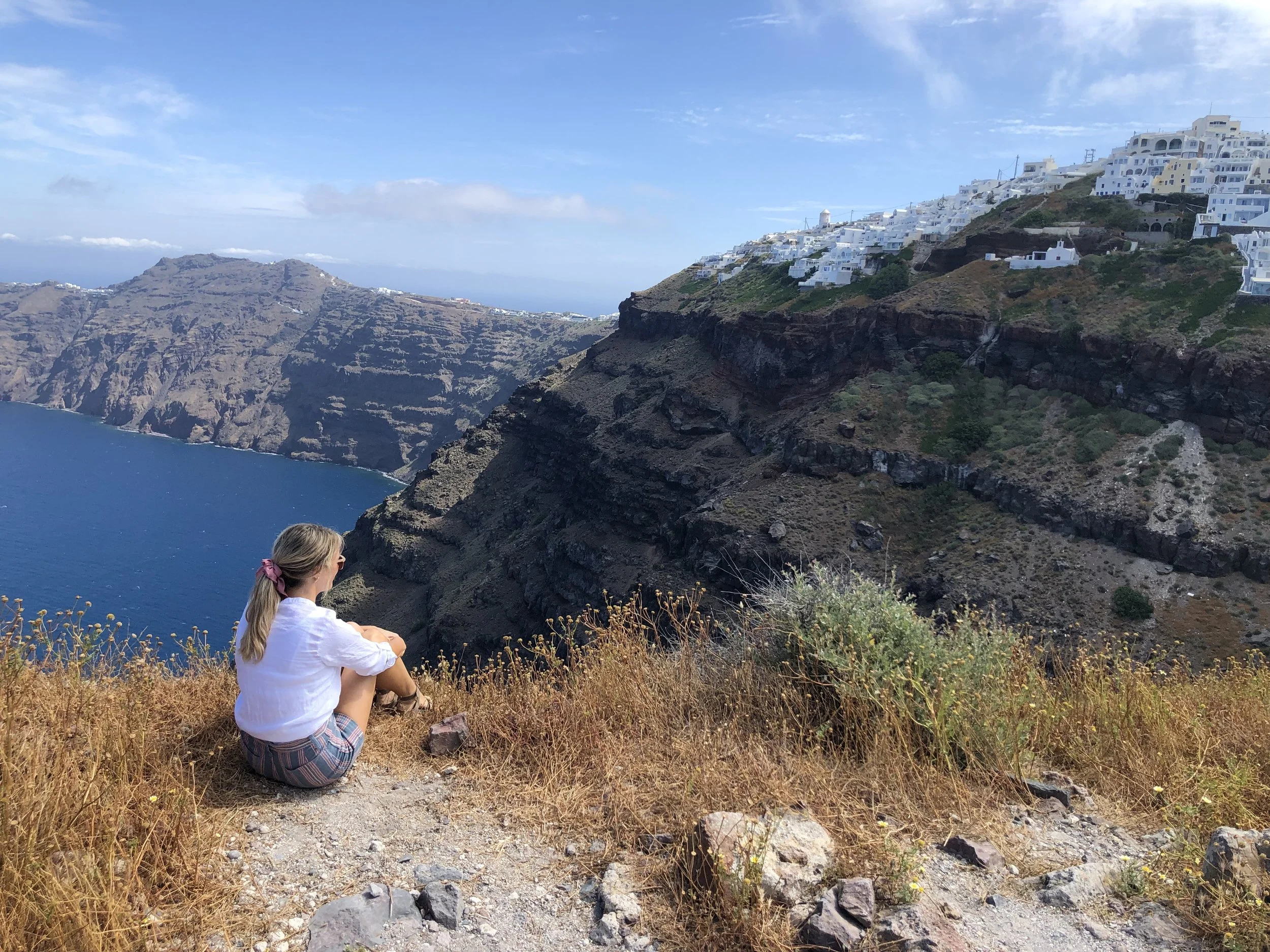 On top of Skaros rock. This is not for littles or people with limited mobility. We had to scale about 15 feet of rock that was at the top of a huge cliff. I’m fairly afraid of heights and it took a lot of self-talk to get me to the top. Worth it, though. The view of Santorini is priceless.