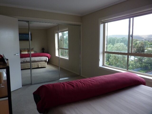 Luxurious sized bedroom with pleasant views and built-in storage