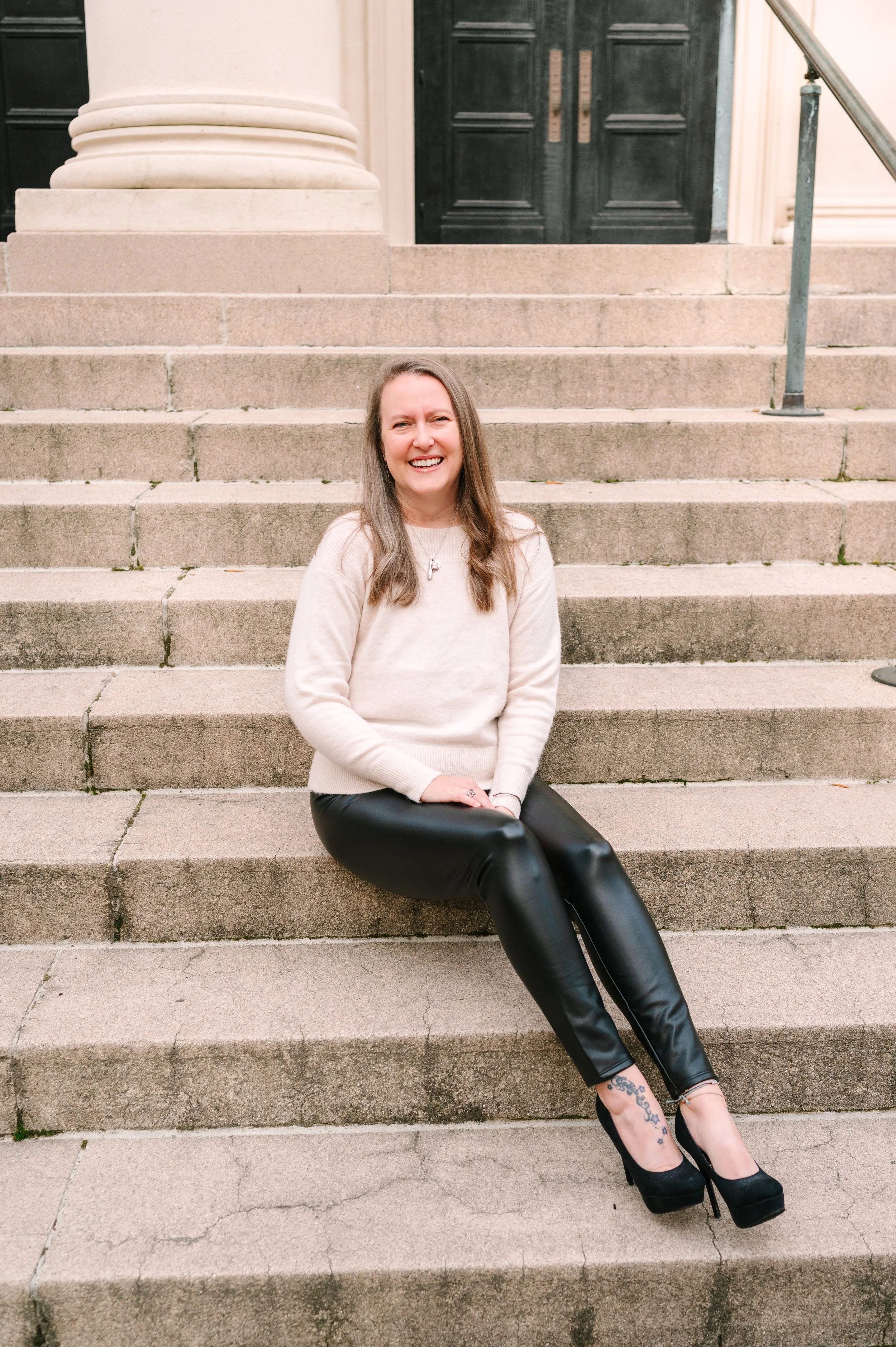 amy capello sitting on stairs