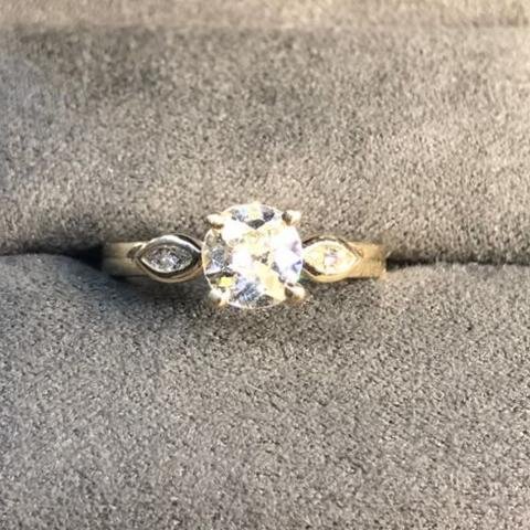 This custom engagement ring showcases a round brilliant cut, one of the most popular and versatile shapes. Made by Secrète in 2017 for a DC couple.